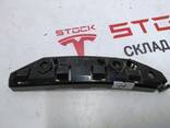 Кронштейн крепления направляющая бампер крыло левый Tesla model 3 1084181-00-E - photo 1